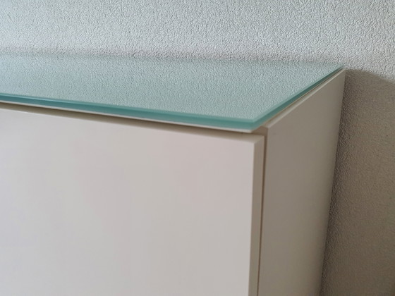 Image 1 of White modern sideboard with a separate glass top. Heavy-duty quality.