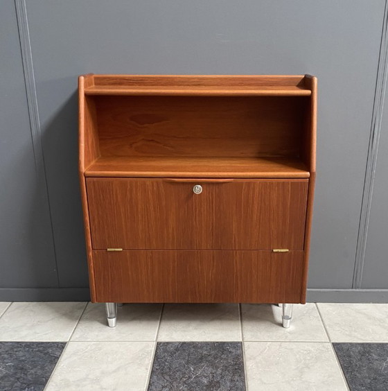 Image 1 of Teak tall sideboard on lucite legs 1960s