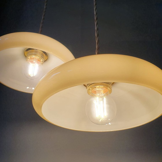 Image 1 of Vintage French pendant lamp set - of pastel yellow opaline glass.