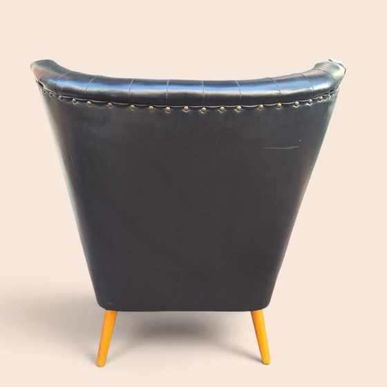 Vintage armchair black faux leather with wooden legs, Plastic (photo 6 of 6)