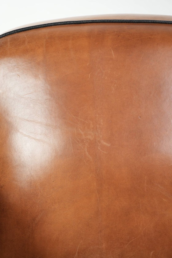 Image 1 of Unieke schapenleren art Deco fauteuil met mooi houtsnijwerk en zwarte biezen