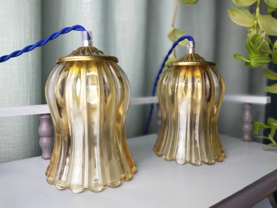 Image 1 of Pair of lamps in fluted gold glass
