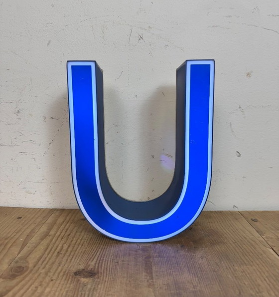 Image 1 of Industrial dark blue enamel factory pendant light made in United Kingdom during the 1950s. White enamel inside the shade. Brass 