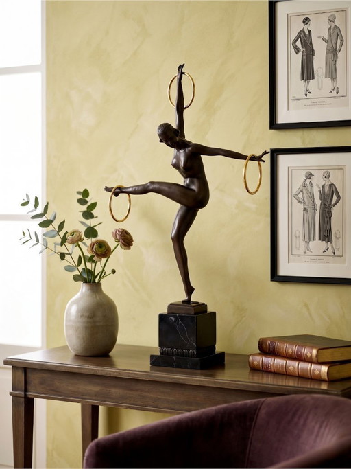 Art Deco sculpture of a dancer with rings in patinated bronze on a black marble-effect base – signed Duvernet – 58 cm