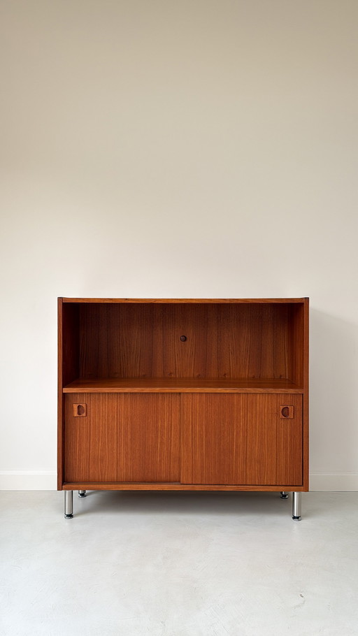 Vintage wooden cabinet with sliding doors