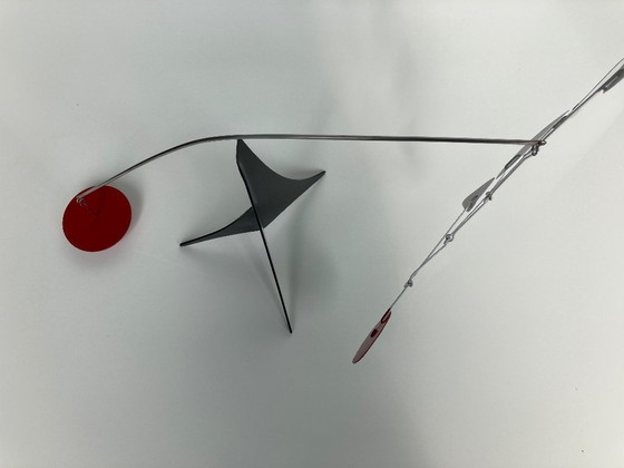 Image 1 of Black tripot, 4 leaves and a red disc