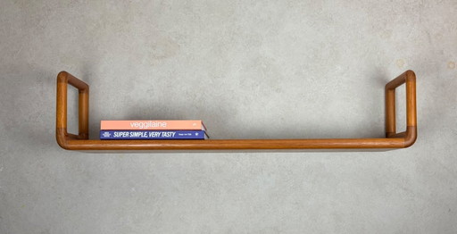 Estantería de pared vintage Dyrlund, estante de teca con forma orgánica.