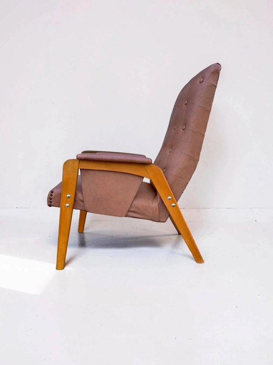 Vintage armchair in light brown faux leather, 1960s. – Wood (photo 3 of 10)