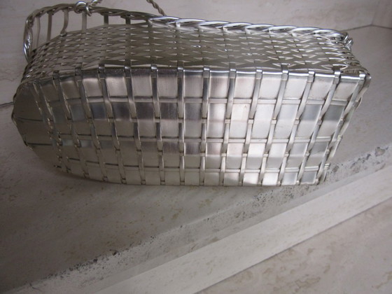 Image 1 of Porte-bouteille de vin vintage en fil de fer argenté.