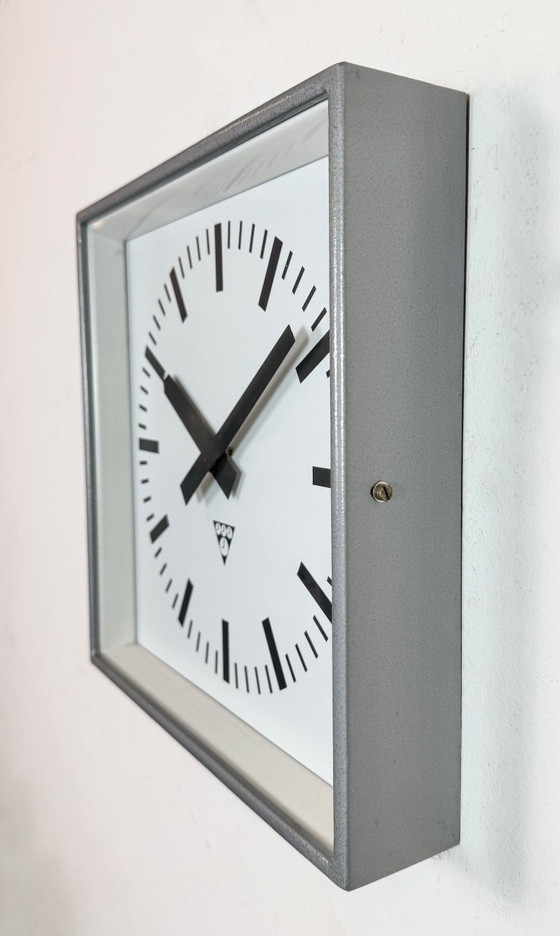 Image 1 of Grijze industriële vierkante wandklok van Pragotron, jaren 70.