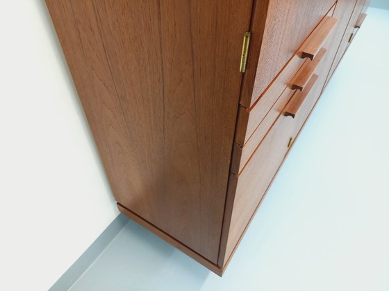 Image 1 of Tall, modernist, vintage Scandinavian sideboard in teak and black metal from the 1960s