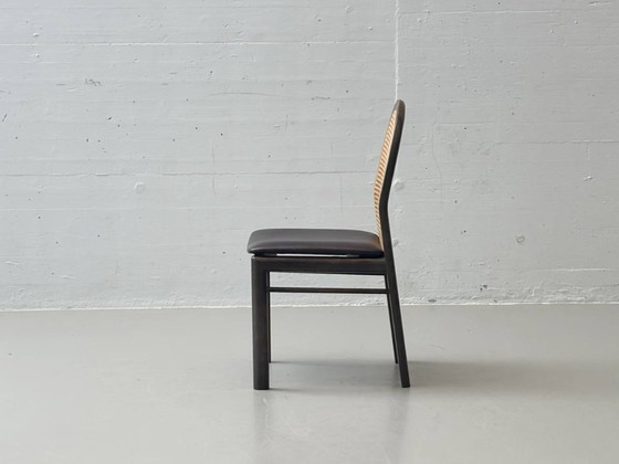Image 1 of Set van 6 stoelen met rieten en lederen zittingen van Dietiker, jaren 80.
