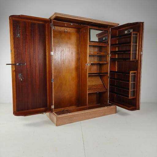 Men's wardrobe from the 1920s by Compactom Ltd in light oak.
