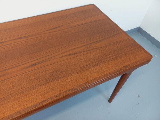 Image 1 of Scandinavian rectangular vintage dining table by Johannes Andersen for Samcom from the 60s in teak with integrated extensions