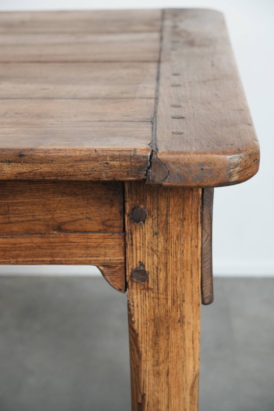 Image 1 of Robust antique French 6-person dining table made of fruit wood with 3 drawers from the late 18th century