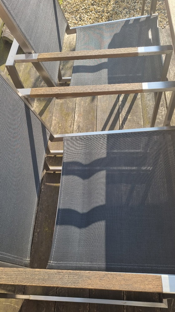 Image 1 of Set da giardino con tavolo in teak e 4 sedie in acciaio inox, realizzato in teak e textilene.