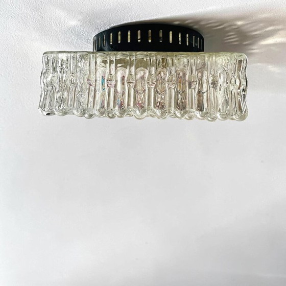 Image 1 of A large flush mount designed for both wall and ceiling application, in the 1970s.  This particular type of fixture tends to sit 