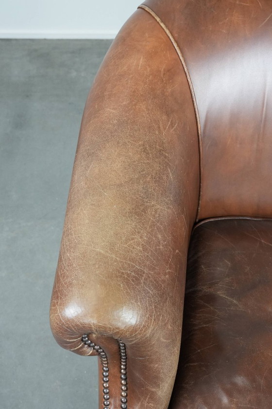 Image 1 of cognac kleurige vintage rundleren clubfauteuil in Engelse stijl 