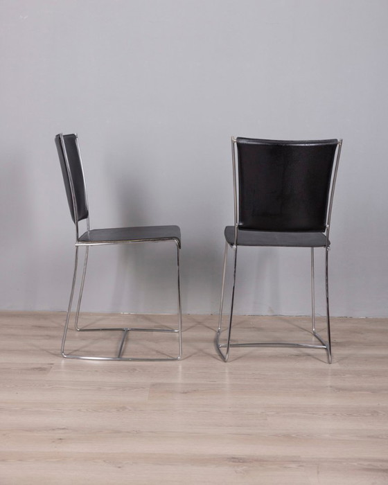 Image 1 of Een paar vintage leren stoelen uit de jaren 90, ontworpen door Segis Italia.