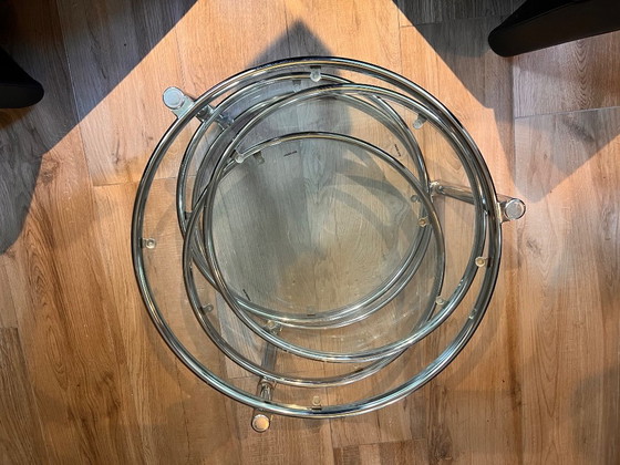 Unique vintage Italian coffee table with chrome frame and four round glass tops. Three outer tops can be (photo 8 of 10)
