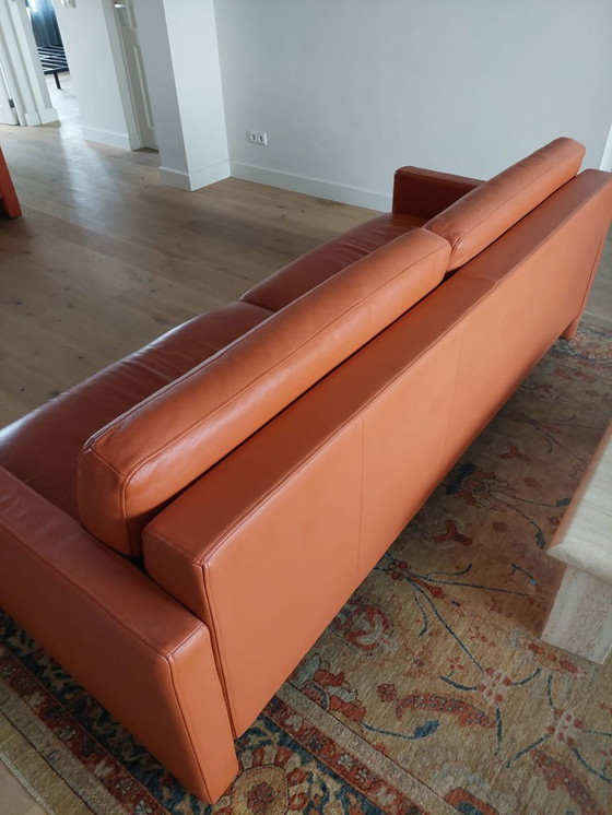 Image 1 of Rolf Benz 4-seater leather sofa, orange/terracotta.