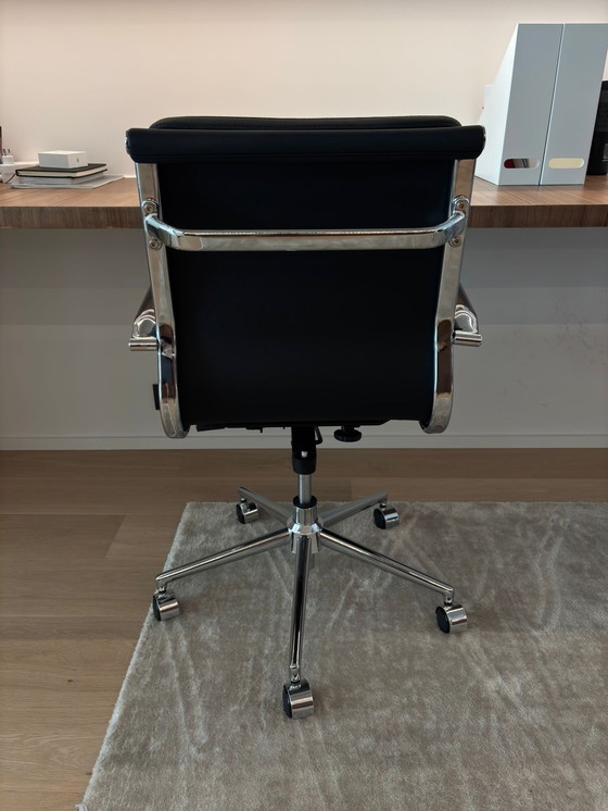 Image 1 of Eames black imitation leather office chair with castors.