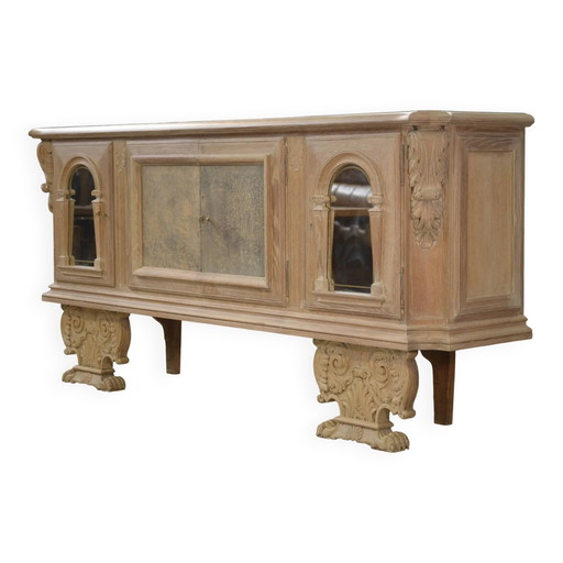 Large buffet with 4 doors in cerused oak, eglomisé mirror and 1950s leather.