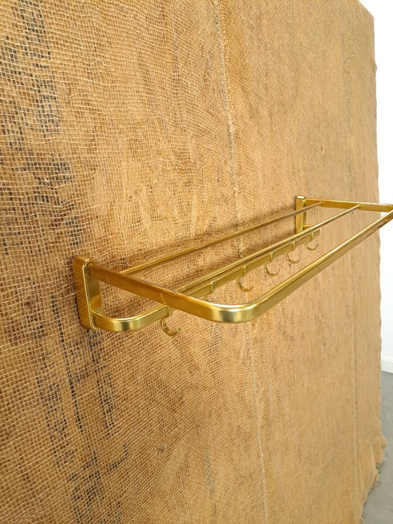 Image 1 of Porte-manteau en forme de train, couleur or, avec crochets, n° 18