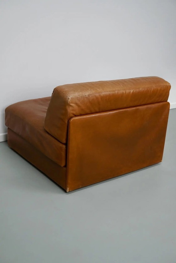 Image 1 of De Sede DS 76 loungestoel / slaapbank van cognackleurig leer, Zwitserland, jaren 1970
