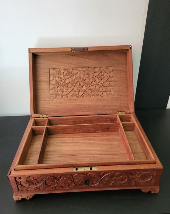 Image 1 of Hand-engraved wooden jewelry box with peacock and floral motifs.