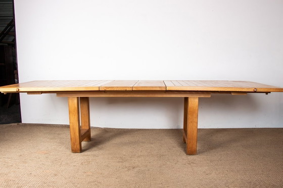 Image 1 of Gran mesa de comedor extensible de roble macizo, diseñada por Guillermo y Chambron en 1960.