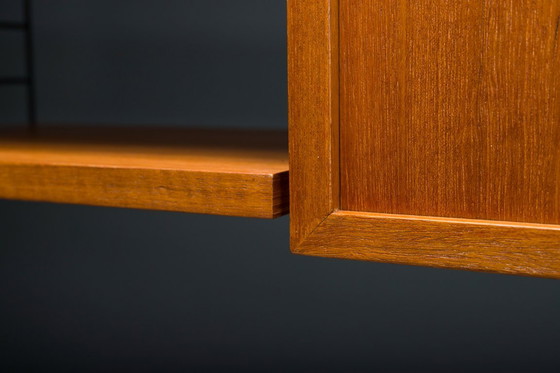 Image 1 of Modulaire wandplank in teak van Nils Strinning voor String, 1960, set van 29