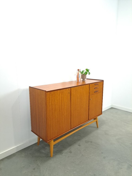 Image 1 of Armadio in teak con gambe inclinate e cassetti dalla Svezia