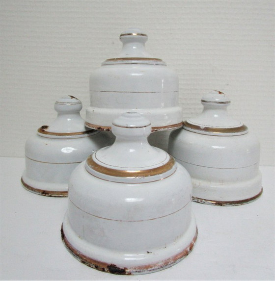 Image 1 of four enameled metal cheese bells, early 20th century