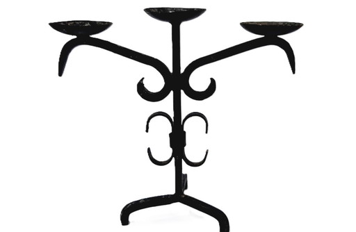 Antique triple candle holder of hand wrought iron