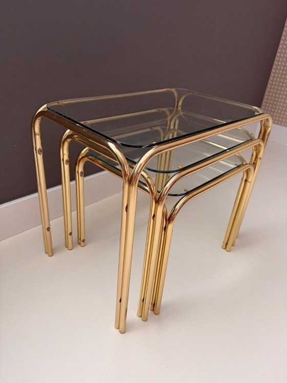 Image 1 of Vintage Mid Century Modern Chrome en glazen bijzettafelset van 3