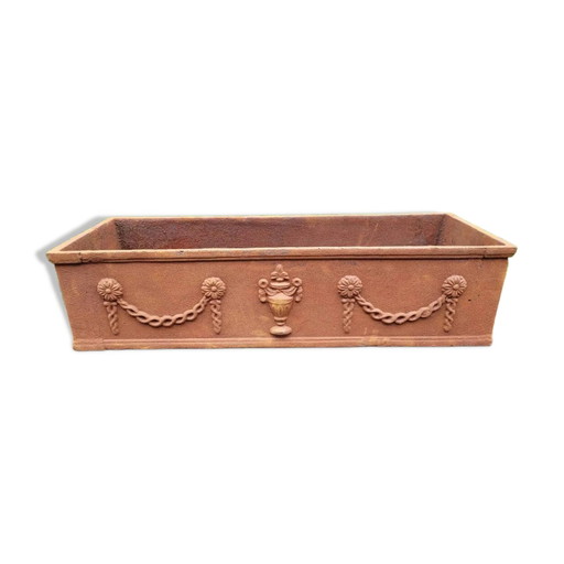 Rusty cast iron jardiniere planter