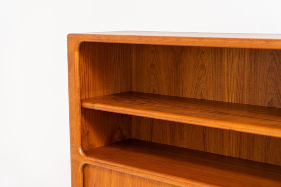 Image 1 of Bookcase in teak by Svend Dyrlund with tambour doors (Denmark, 1960s).