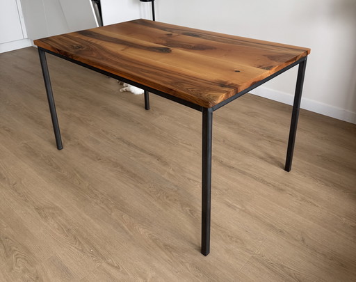 Table with walnut wood top.