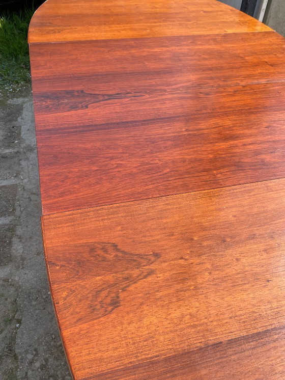 Image 1 of Baumann round oval extendable Scandinavian table in rosewood with 2 extensions, length 166 to 256cm, an60