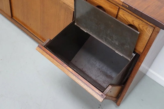 Image 1 of Grote Nederlandse industriële eiken apothekers- / bakkerijkast, ca. jaren 1950