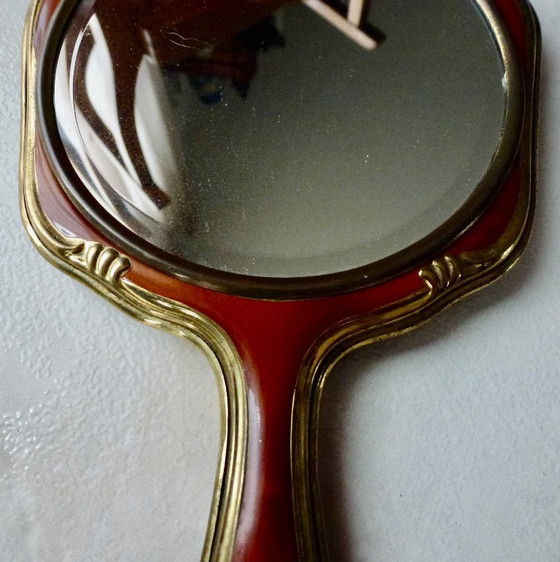 Image 1 of Vintage handspiegel, Facet geslepen, Duitsland, messing met celluloid.