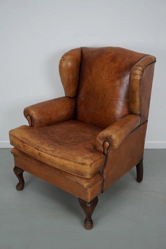 Image 1 of Vintage Nederlandse cognackleurige leren clubfauteuil met voetenbank