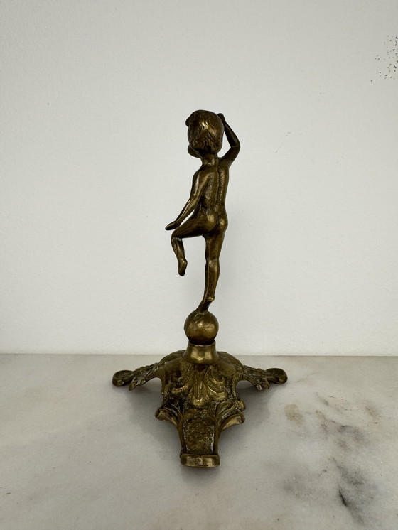 Image 1 of Antique bronze figurine of playing child - decorative and rare