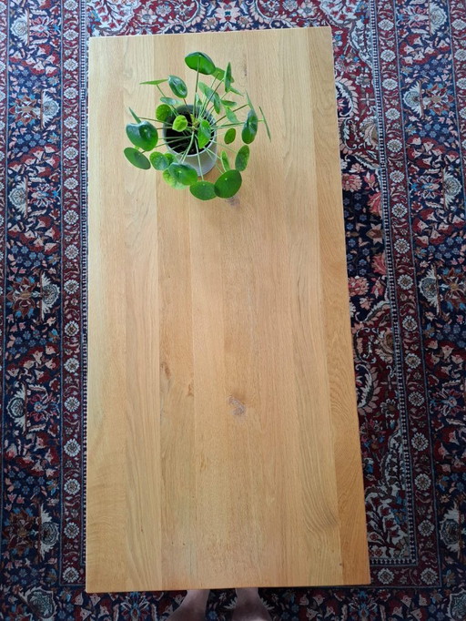Dining room and coffee table, light oak with stainless steel base.