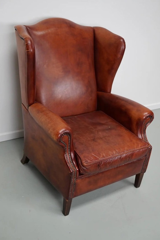 Image 1 of Vintage Nederlandse cognackleurige leren clubfauteuil met vleugelrug