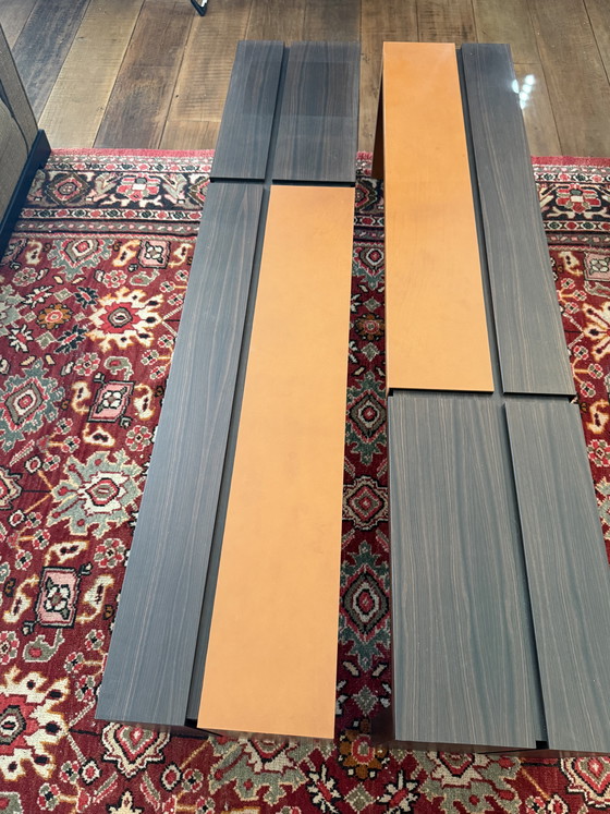 Image 1 of Custom-made, asymmetrical coffee tables (twin) of Macassar wood with orange calfskin details.