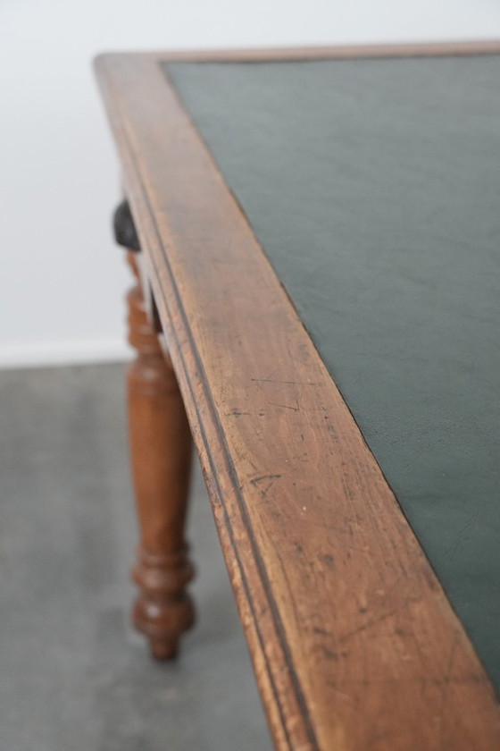 Image 1 of Antique writing table/partner desk with 4 drawers and a green leather top