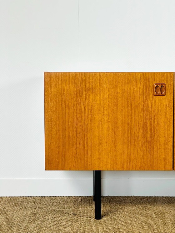 Image 1 of Minimalist Scandinavian sideboard in teak with black metal legs, 1960