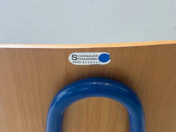 Image 1 of 4 vintage stapelstoelen van het Schönauer schoolmeubilair